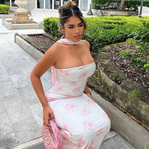 Close-up of pink floral print on a white strapless bodycon maxi dress for women