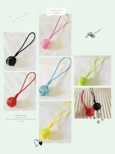 Detailed view of handmade woven monkey fist knot keychains in various bright colors