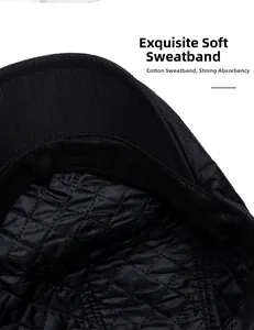 Detail of black newsboy cap featuring diamond quilted lining and cotton sweatband