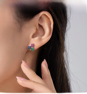Detail of S925 sterling silver flower stud earrings with pink, blue and green zircons
