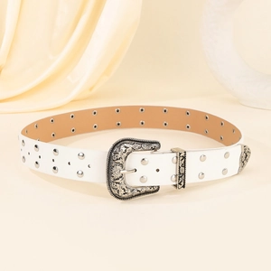 Vintage white studded belt with ornate silver floral buckle on elegant satin background