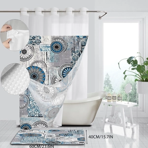 Detail of blue floral shower curtain with waffle texture fabric and matching floor mat