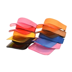 Colorful unisex PVC sun visors for sports featuring translucent brims in various vibrant tones