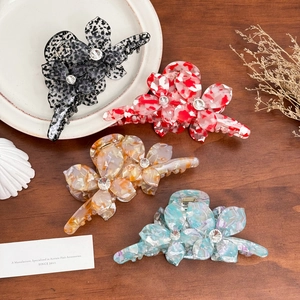 Large acetate flower hair claws with rhinestones in four elegant marble patterns