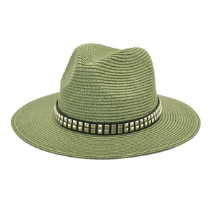 Detail of army green straw fedora hat featuring black leather band with gold square studs