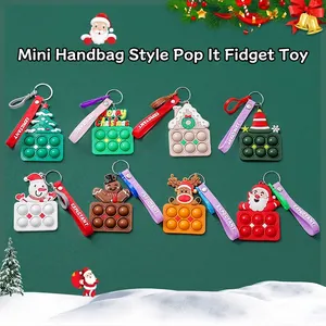 Detailed set of 8 silicone Christmas pop-it keychains with festive holiday shapes
