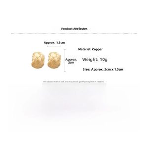Detailed view of golden woven texture earrings with matte finish and copper material specs