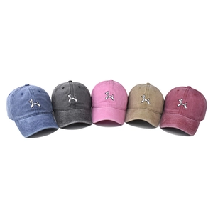 Five assorted colors of washed cotton baseball caps with balloon dog embroidery detail