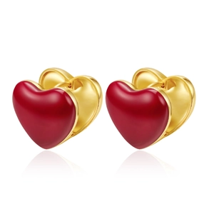 Elegant gold metal heart hoop earrings with red enamel finish on white background