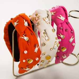 Close-up of Easter knotted headbands with alloy bunnies, pearls, and colorful rhinestones