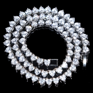 Detail of 5mm silver tennis chain necklace with heart-shaped white cubic zirconia stones