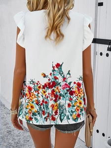 Back view of a white sleeveless floral top with ruffled shoulders and colorful prints