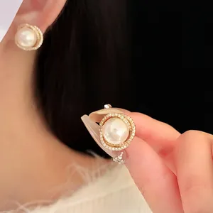 Elegant hollow zircon surrounded pearl earrings with gold plating for women fashion