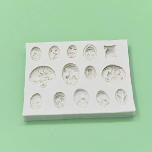 White silicone mold featuring 14 vintage relief portraits and frames for fondant cake art