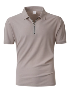 Detailed view of grey-purple polo shirt featuring waffle texture fabric and half-zipper