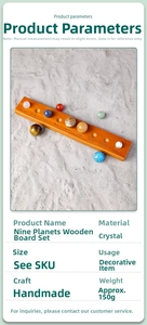 Detailed close-up of natural crystal planets on a wooden base with engraved names
