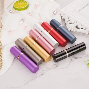 Portable 10ml aluminum perfume atomizers in eight colors on elegant marble display