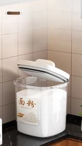 Macro detail of clear flour storage container with airtight white lid on marble countertop