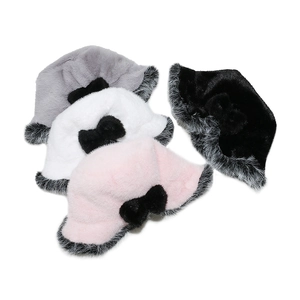 Detail showing multi-color winter faux fur bucket hats with stylish black bow accents