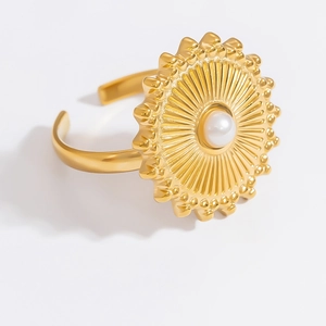 Detailed top view of 18k gold plated sunflower ring with white pearl center and open band