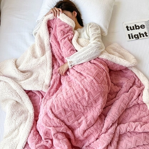 Pink geometric fleece blanket with creamy white sherpa lining for cozy home bedding