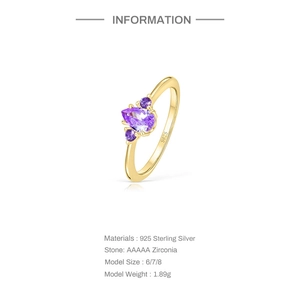 Macro detail of gold S925 silver ring with teardrop purple zircon and size specs