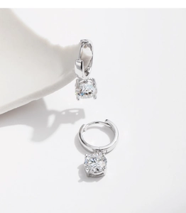 Detailed view of elegant silver moissanite drop earrings on a clean white background