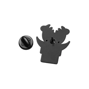 Black metal enamel pin back view with rubber clutch fastener and sharp needle point