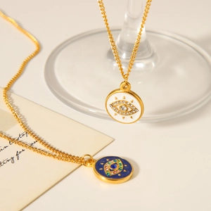 Golden stainless steel necklaces featuring white and blue enamel evil eye pendants