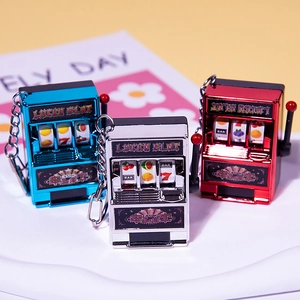 Mini slot machine keychains in shiny red silver and blue with movable levers