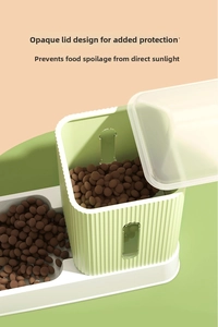 Detail view of the opaque green pet feeder lid designed to block sunlight and keep food fresh