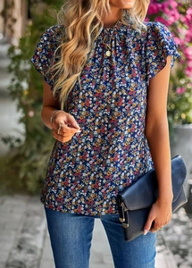 Detail of floral ruffled sleeves and pleated collar on navy blue boho blouse