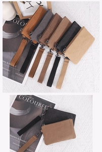 Detailed close-up of colorful canvas coin purses with zippers and matching wrist straps