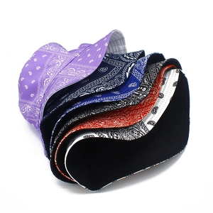 Stacked collection of colorful bandana bucket hats with paisley print for sun protection