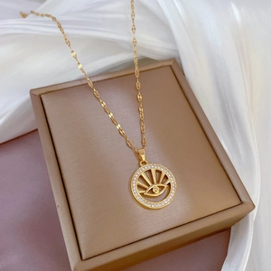 Luxurious gold evil eye necklace with micro-paved zircons and sparkling crystals