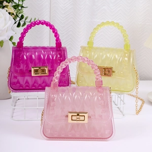 Mini PVC jelly handbags with leaf pattern in dark pink, yellow, and light pink colors