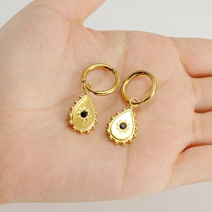 Gold-plated stainless steel teardrop hoop earrings with black zircon sunburst charm