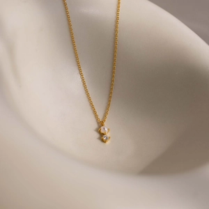 Gold plated titanium steel necklace with white pearl and sparkling zircon stone