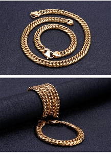 Close-up of golden stainless steel Cuban link chain necklace and bracelet with lobster clasp