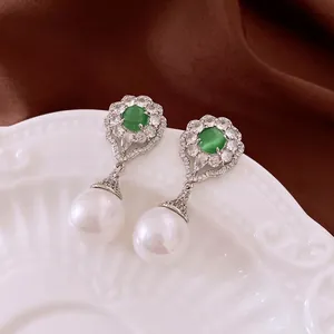 French vintage earrings with green cat-eye stone, sparkling zircons, and white pearl drops
