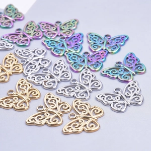 Detailed view of hollow butterfly pendants in gold, silver, and rainbow for DIY jewelry