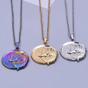 Close-up of wolf head embossed round pendants in rainbow, gold, and silver stainless steel