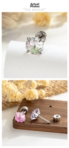 Macro shot of petal-cut gradient zircon stud earrings with screw ball backs