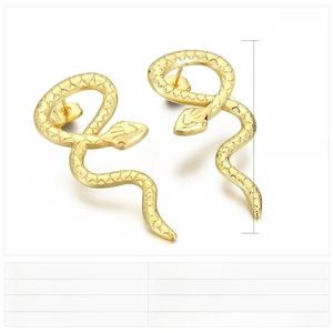 Macro detail of gold snake earrings with scale texture and 40x17mm dimensions