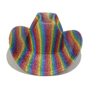 Close-up of vibrant rainbow striped cowboy hat with shimmering sequins for festive parties