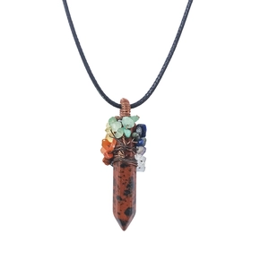 Macro shot of tree of life wire wrapped hexagonal crystal pendant with multi-color stones