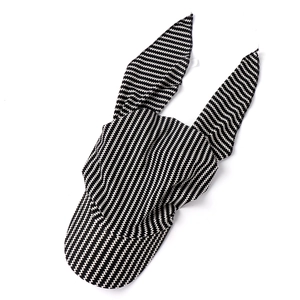 Detail of headwrap hat with black and white zigzag pattern and bunny ear tie design