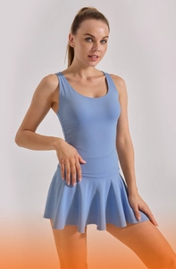 Detail of light blue tennis dress featuring U-neck sleeveless top and pleated skirt design