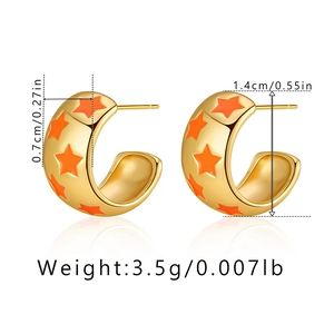 Detail view of gold C-shaped earrings with orange stars and precise size measurements