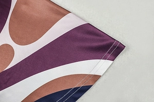 Detailed macro view of geometric print pattern and high-quality silk finish fabric